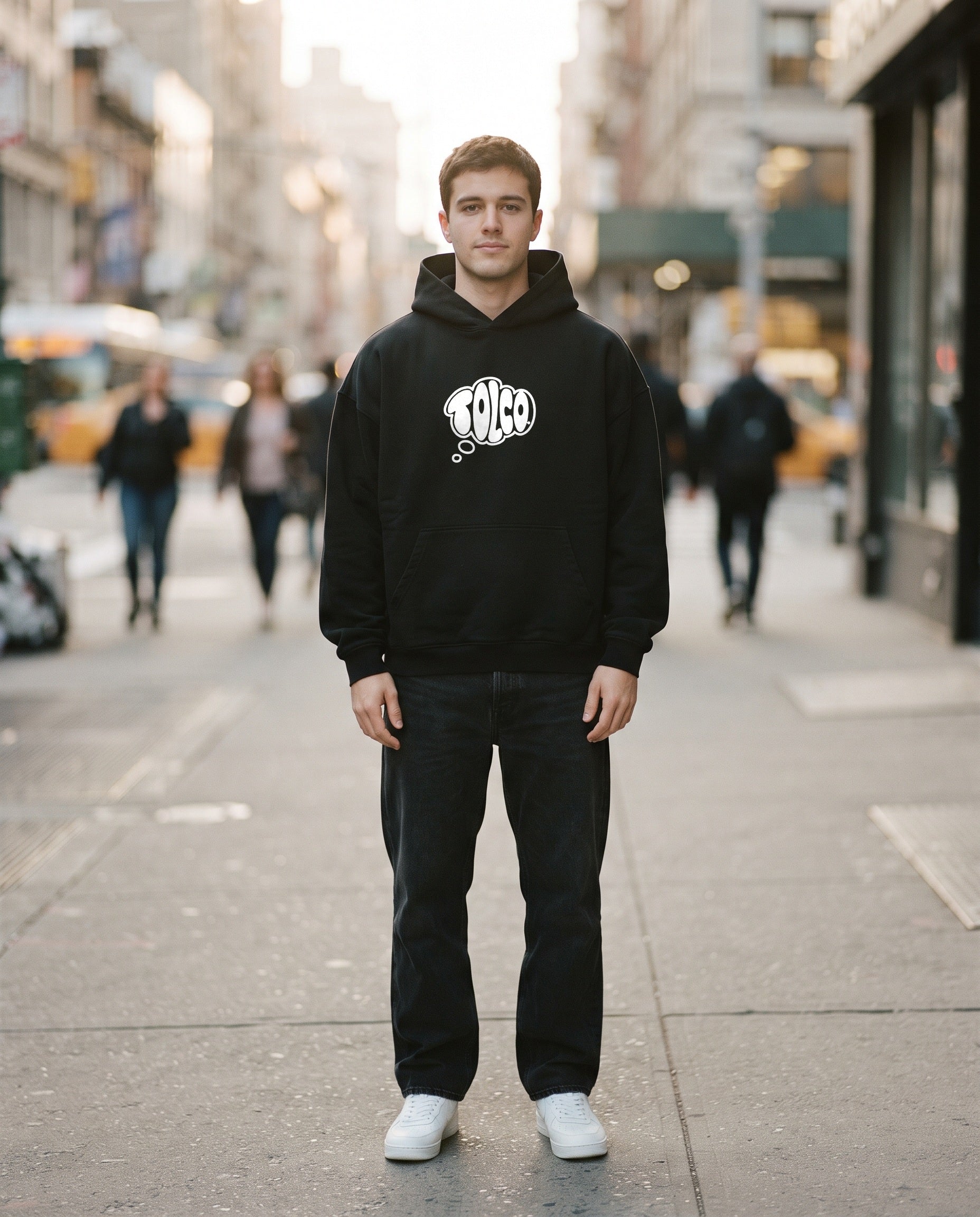 TOLCO on-model: TOLCO. - CORE - Heavyweight Hoodie - Black, front view, worn on the street