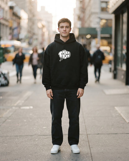 TOLCO on-model: TOLCO. - CORE - Heavyweight Hoodie - Black, front view, worn on the street