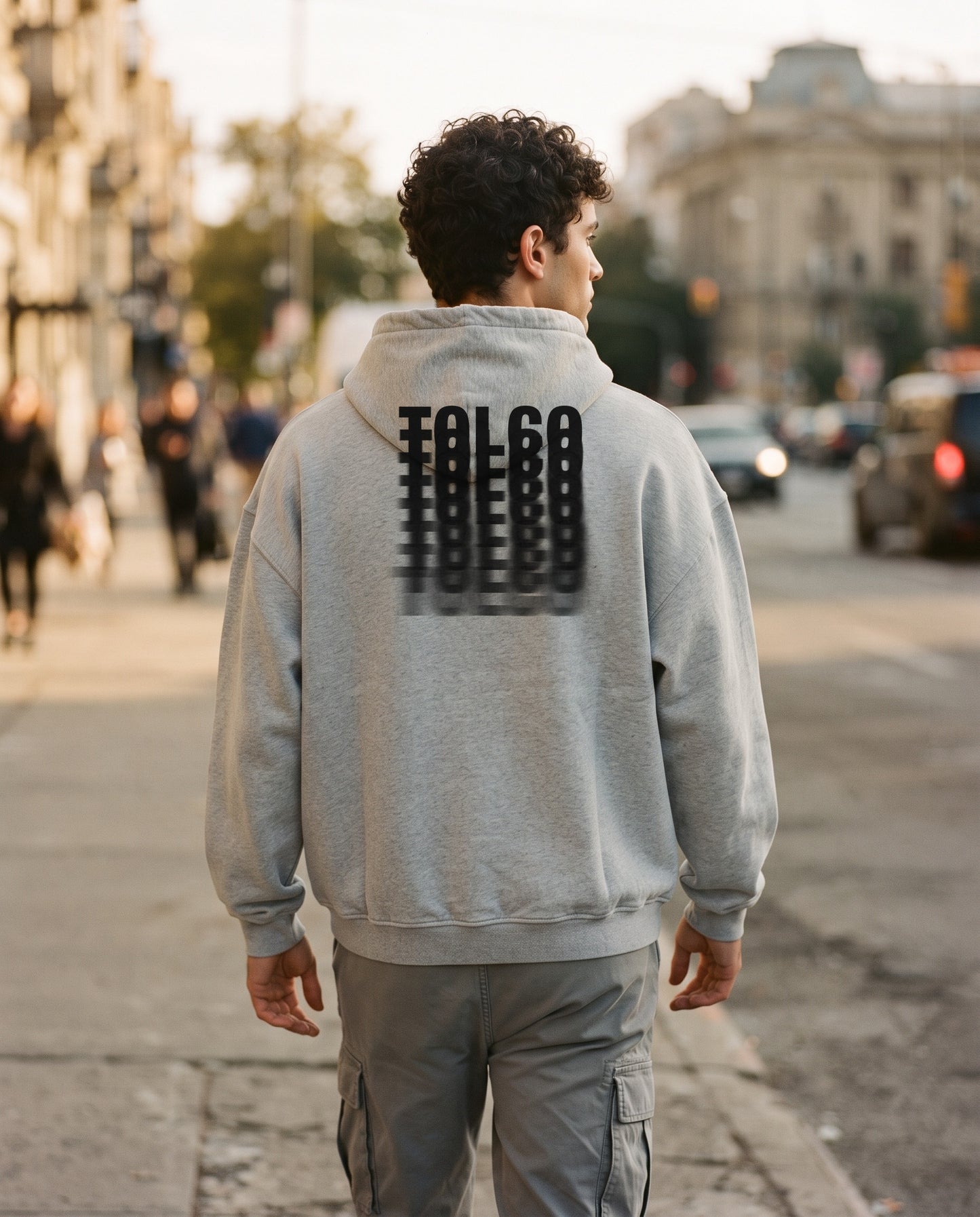 TOLCO on-model: TOLCO. - DRIFT - Snow Washed Hoodie - Light Gray, back view, worn on the street